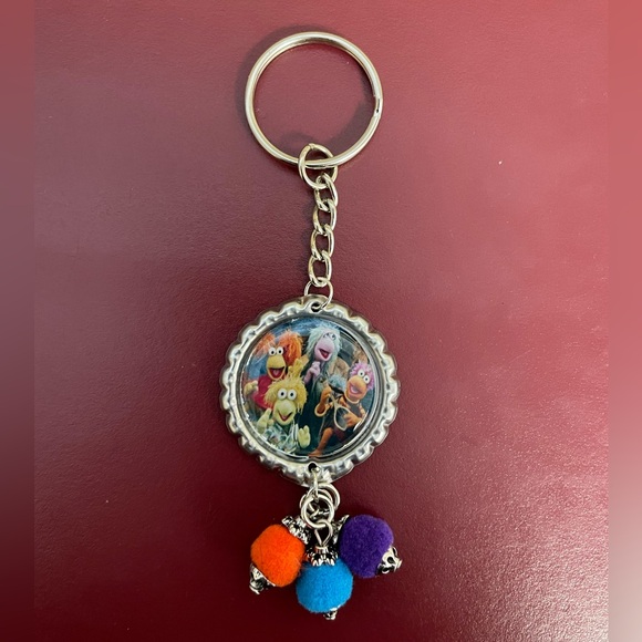 Handmade Fraggle Rock Bottle Cap Keychain with Poms - Picture 1 of 3